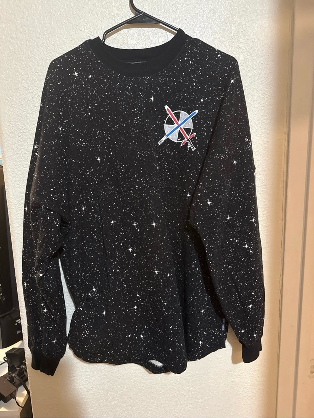 Disney Black Starfield Spirit Jersey Sweater with Red & Blue Space Logo